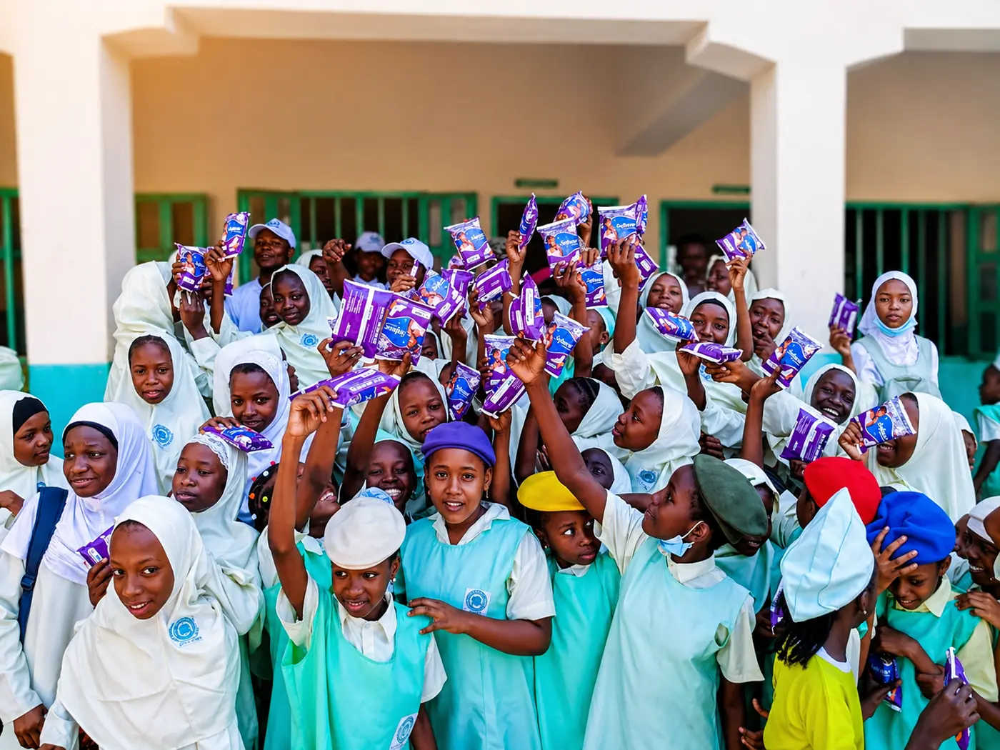 Pad-A-Girl distribution  girls celebrating menstrual dignity kits.