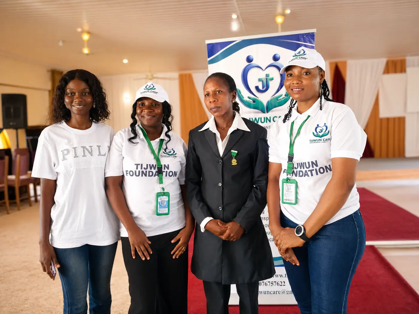 TIJCEF team with a community partner during an empowerment event.